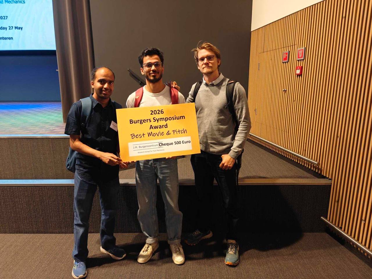 Best Video Award at JMBC Burgers Symposium 2026 — Ayush Dixit's work on respiratory droplet formation and viscoelastic fluid dynamics.